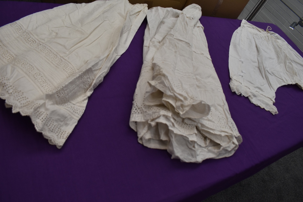 Two Victorian petticoats and a set of bloomers.