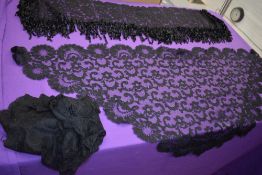 A selection of lace comprising of a black Victorian Fichu and two shawls/scarves.