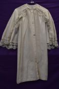 A late 19th/early 20th century childrens or young teens silk robe with integrated shawl with