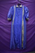 A 1930s purple taffetta house coat, having long zip to front(thought to be a later addition) and