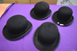 Four early 20th century bowler hats.