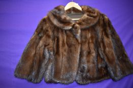 A 1960s chestnut brown mink jacket having 3/4 length sleeves.