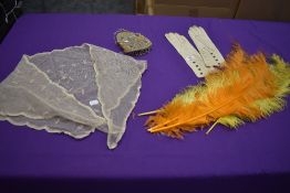 A mixed lot including beaded Victorian coin purse,tulle shawl, gloves and four long dyed feathers.