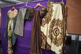 A mixed lot of vintage clothing, predominantly 1960s and 70s including ethnic print wrap skirt and