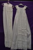 An extensively embroidered Victorian christening gown, having short sleeves,pin tucks to lower