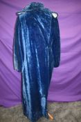 A blue velvet full length opera coat circa 1920s/30s, lined in cream satin or satin blend having