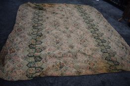 An early 20th century floral quilt having over stitched braided detailing to front.
