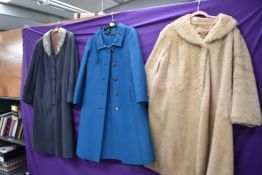 A 1960s jacket and dress set in teal blue, a Wool swing coat with astrakhan or similar collar and