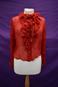 A red 1940s crepe georgette blouse having ruffled neckline, around an extra small in size.