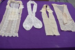 Four early 20th century modesty panels,some tulle backed, all with intricate lace work or crochet