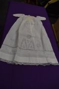A fine cotton Victorian christening dress having delicate embroidery.