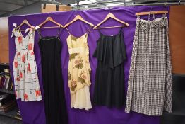 A mixed collection of ladies vintage dresses, predominantly 60s and 70s.