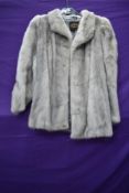 A 1970s silver mink shorter length coat or jacket having Blackpool furriers label.