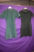 Two mid century nurses uniforms in green.