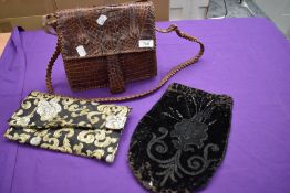 A black velvet beaded Victorian bag sold with an Alligator or similar satchel and an evening bag.