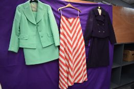 A 1960s striped maxi skirt. A 1970s green skirt suit and another dress suit in plum.