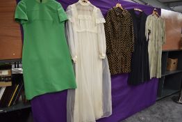 A selection of mixed 1960s and 70s dresses, various styles and sizes.