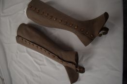 A pair of Edwardian beige wool ladies gaiters with button sides.