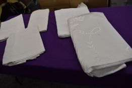 Four large antique damask tablecloths and another similar embroidered table cloth.