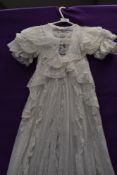 An ornate lawn cotton Victorian gown using an abundance of tulle lace.