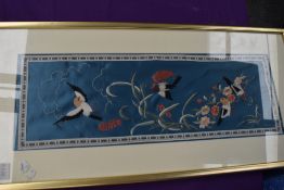 A framed and glazed, oriental silk picture depicting birds and foliage.