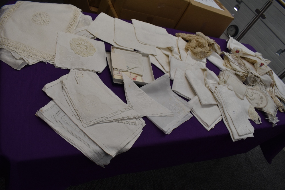 A large collection of antique table linen etc including crotchet mats, damask table cloths,napkins
