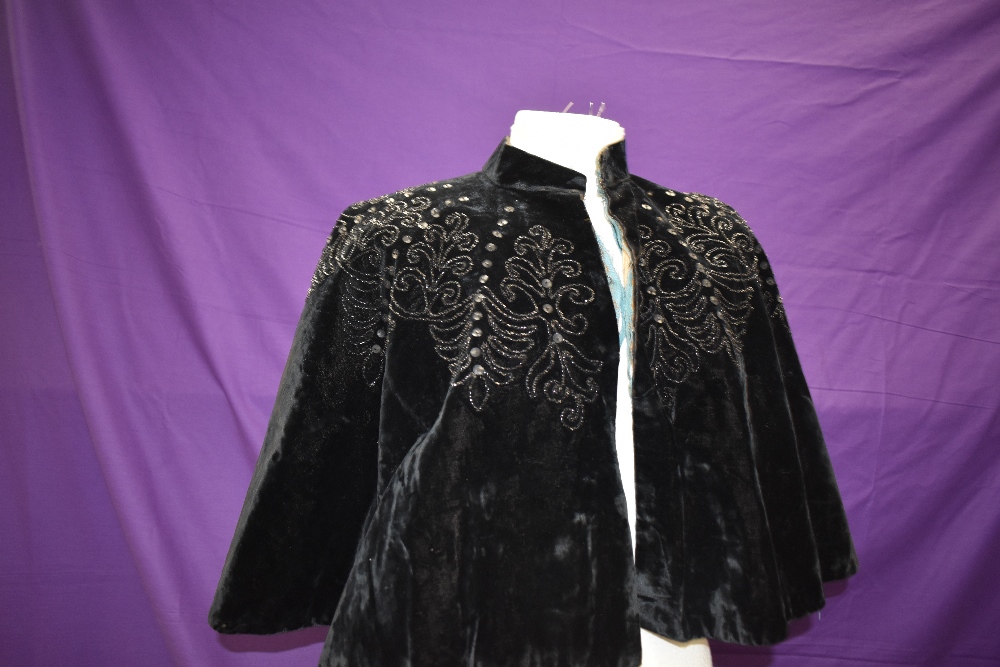 A Victorian velvet cape having black glass and sequins.