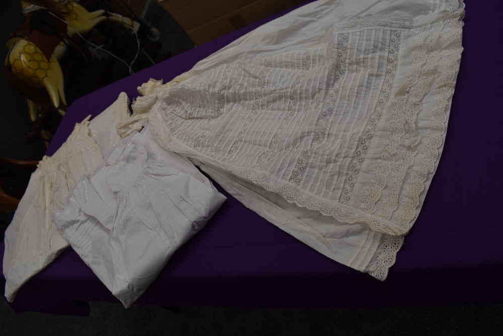 Three Victorian christening gowns using delicate lace work,cut work and pintucks.