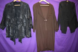 A 1930s art deco coat in brown crepe and two similar jackets/cover ups in black.