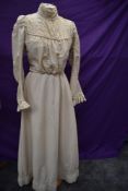 An Edwardian cream two piece outfit comprising of skirt and bodice in what feels to be a cotton/silk