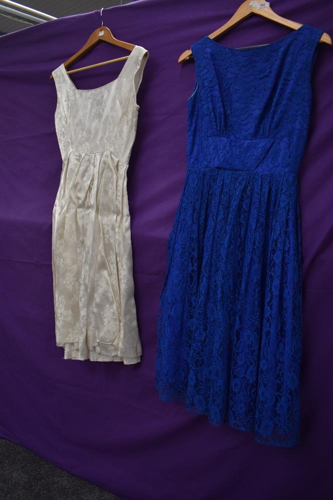 Two 1950s dresses, one blue lace with gathered waist detail,the other of white brocade. - Image 2 of 2