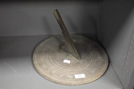 A heavy cast bronze sun dial having unusual date or similar calendar, having makers name but