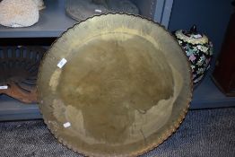 A large brass Indian style table top or wall plaque