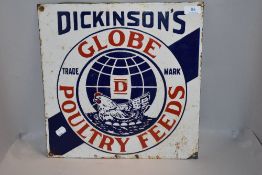 A vintage Dickinson's 'Globe Poultry Feeds' enamel sign