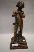 After Jean Louis Gregoire, A 19th century French Zamak figurine depicting a young boy playing a