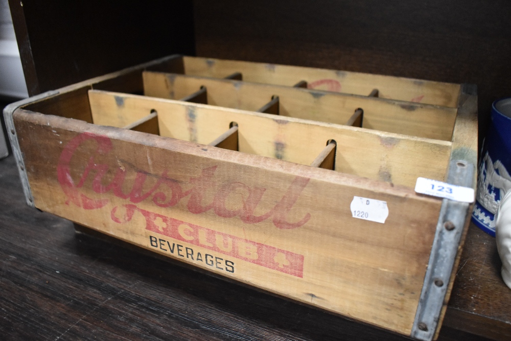 A vintage 'Crystal Club Beverages' wooden advertising crate with applied galvanised strengthening
