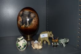 A modern decorated osterich egg with stand, two carved stone elephants, miniature Masons ginger