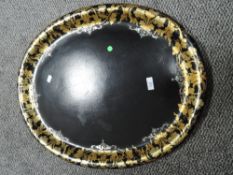 A large Victorian papier mache tray decorated with gilt and mother of pearl inlay