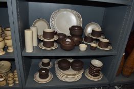 A quantity of stoneware dinner and teawares, with attractive speckled and geometric designs,