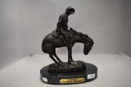 A 20th century bronze cast figure of an American settler by Frederic Remington titled Norther