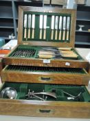 An Edwardian lockable oak case canteen of cutlery by Thomas Turner Encore