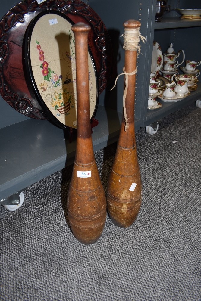 Two antique wooden Jugglers clubs.