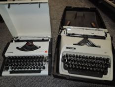 Two vintage typewriters including Scheidegger and Olympia Traveller Deluxe