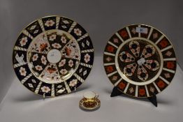 Two Royal Crown Derby display plates in Imari Palette designs with a similar miniature cabinet tea