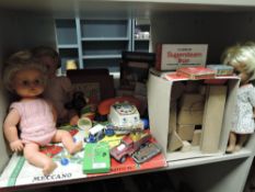 A selection of childrens toys and games including Meccano and dolls