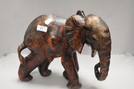An ethnic wood hand carved figure of an African Elephant