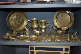 A good collection of brass wares including horse brass, hardware and Nelson's flagship plate