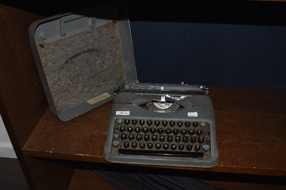 A 1950's Hermes 'Baby' typewriter, in textured grey