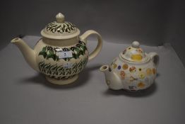 Two modern tea pots in traditional designs one by Emma Bridgewater and similar by Caroline Nash