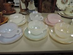 A set of Arc Opal harlequin tea cups and saucers